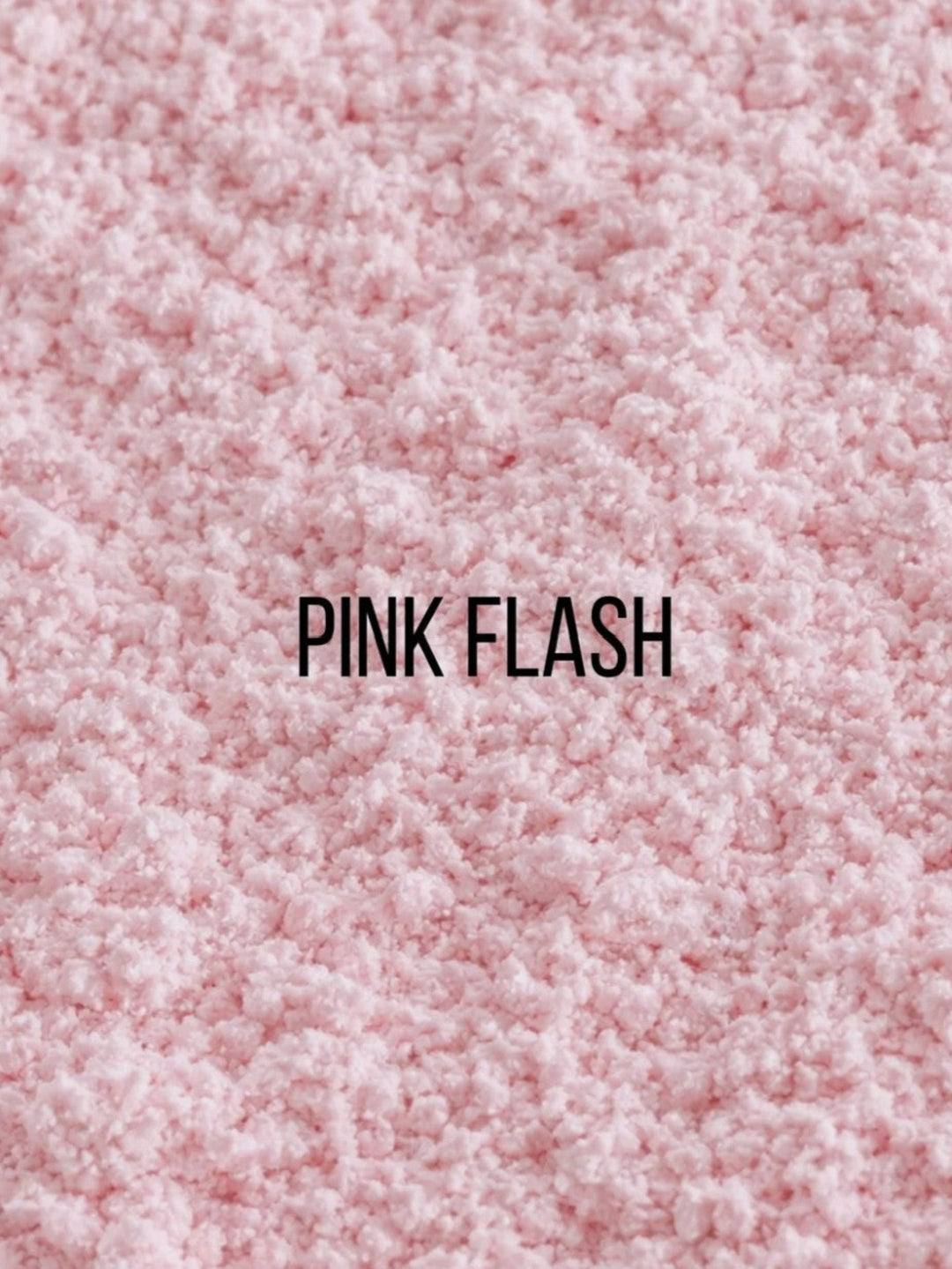 A close-up texture shot of a fluffy pink faux fur or sherpa fabric, with the text &