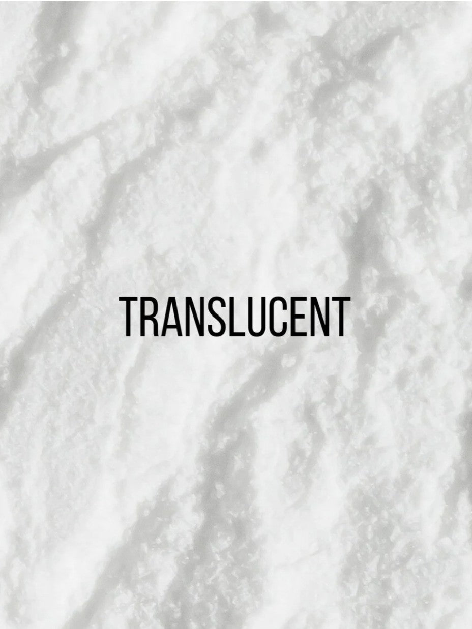 A close-up texture shot of a white translucent material with the word &
