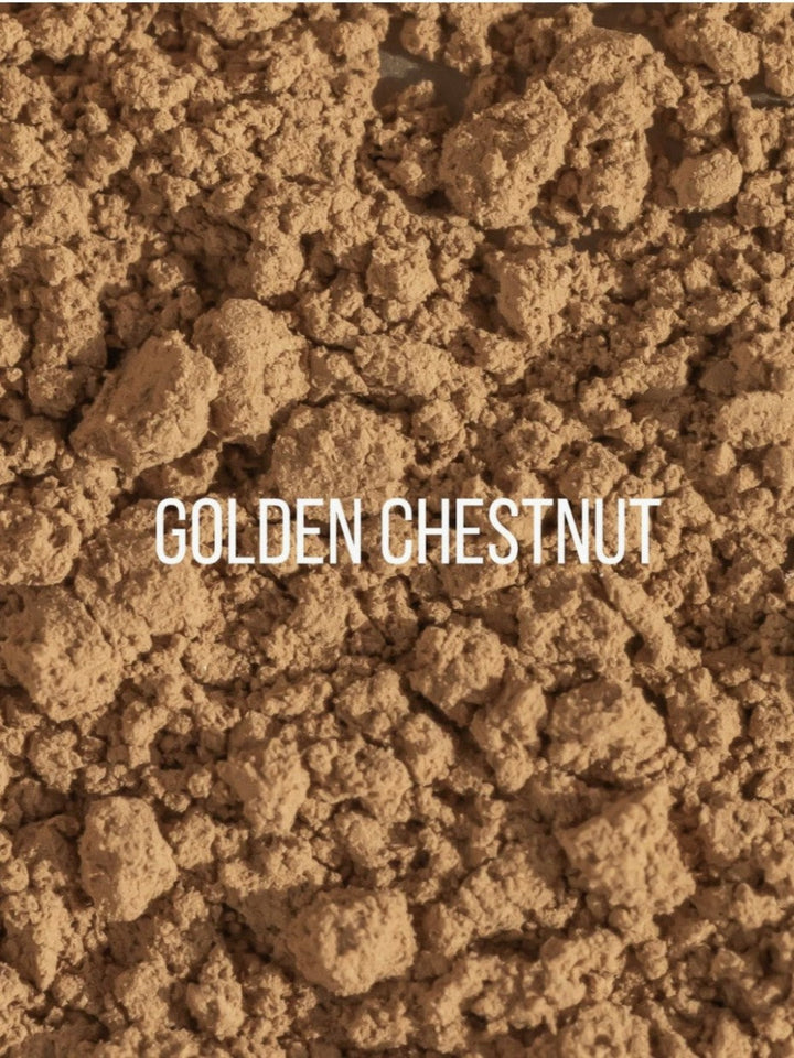 A close-up texture shot of golden-brown powder or granules with the text &