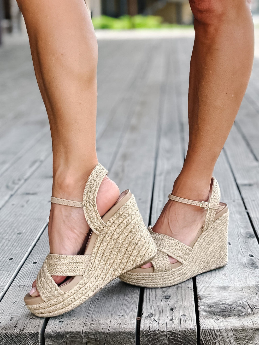 Side view of a natural jute Alouette Wedge Sandal with a 4-inch heel and adjustable ankle strap.