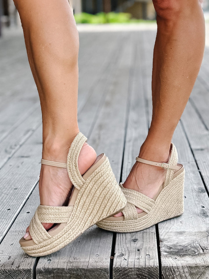 Side view of a natural jute Alouette Wedge Sandal with a 4-inch heel and adjustable ankle strap.