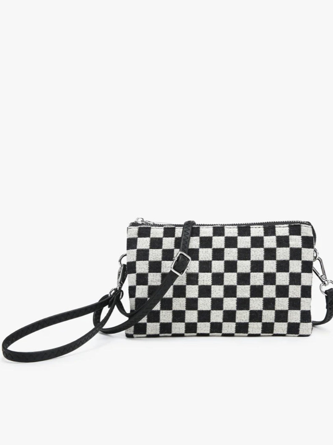 A small black and white checkered crossbody clutch bag with a black wrist strap and silver-tone hardware, shown against a plain white background.
