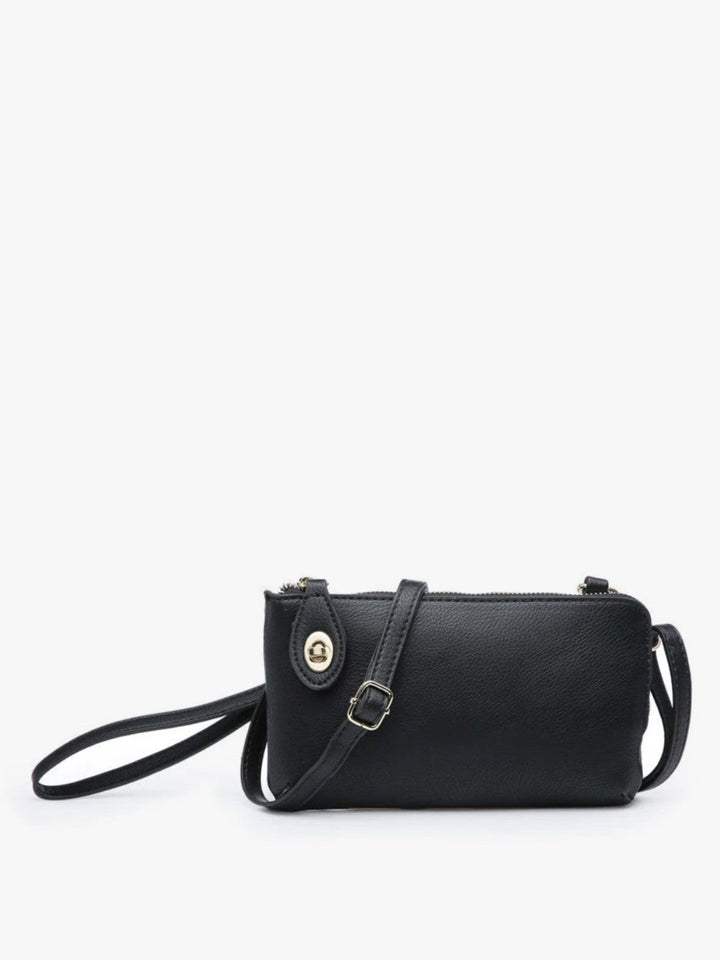 A black pebbled leather crossbody bag with a wristlet strap and a small gold-tone snap button closure, shown against a plain white background.