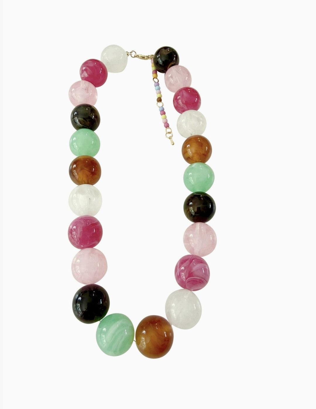 A beaded necklace made of polished round gemstone-like beads in multiple colors including pink, green, white, brown, black, and orange, with a small beaded charm and gold-tone clasp, shown on a plain white background.