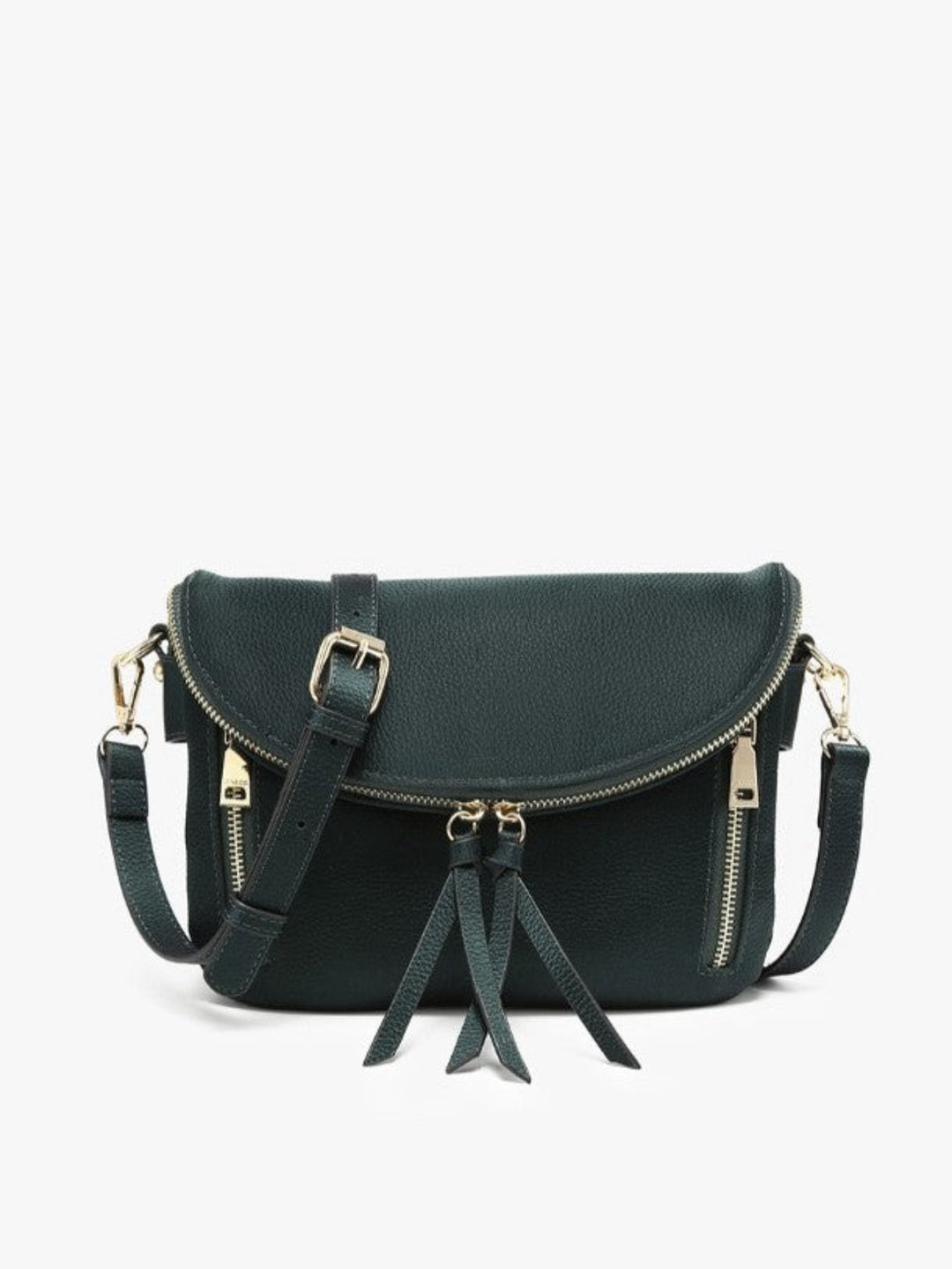 A dark green faux-leather crossbody bag with gold-tone hardware, featuring a front flap with a buckle, a top zipper, side zippers, and two hanging tassels, shown against a plain white background.