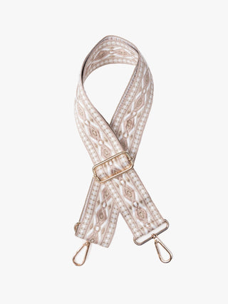 A fabric shoulder strap with an intricate beige and white geometric pattern, featuring a gold-tone metal buckle and two matching gold-tone swivel clips at the ends, displayed on a clean white background.