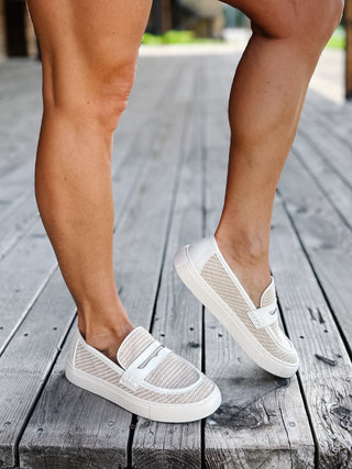 White combo slip-on loafers with breathable woven upper and leather accents.