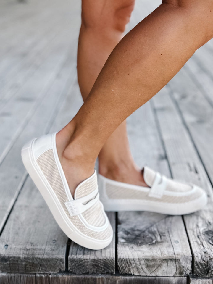White combo slip-on loafers with breathable woven upper and leather accents.