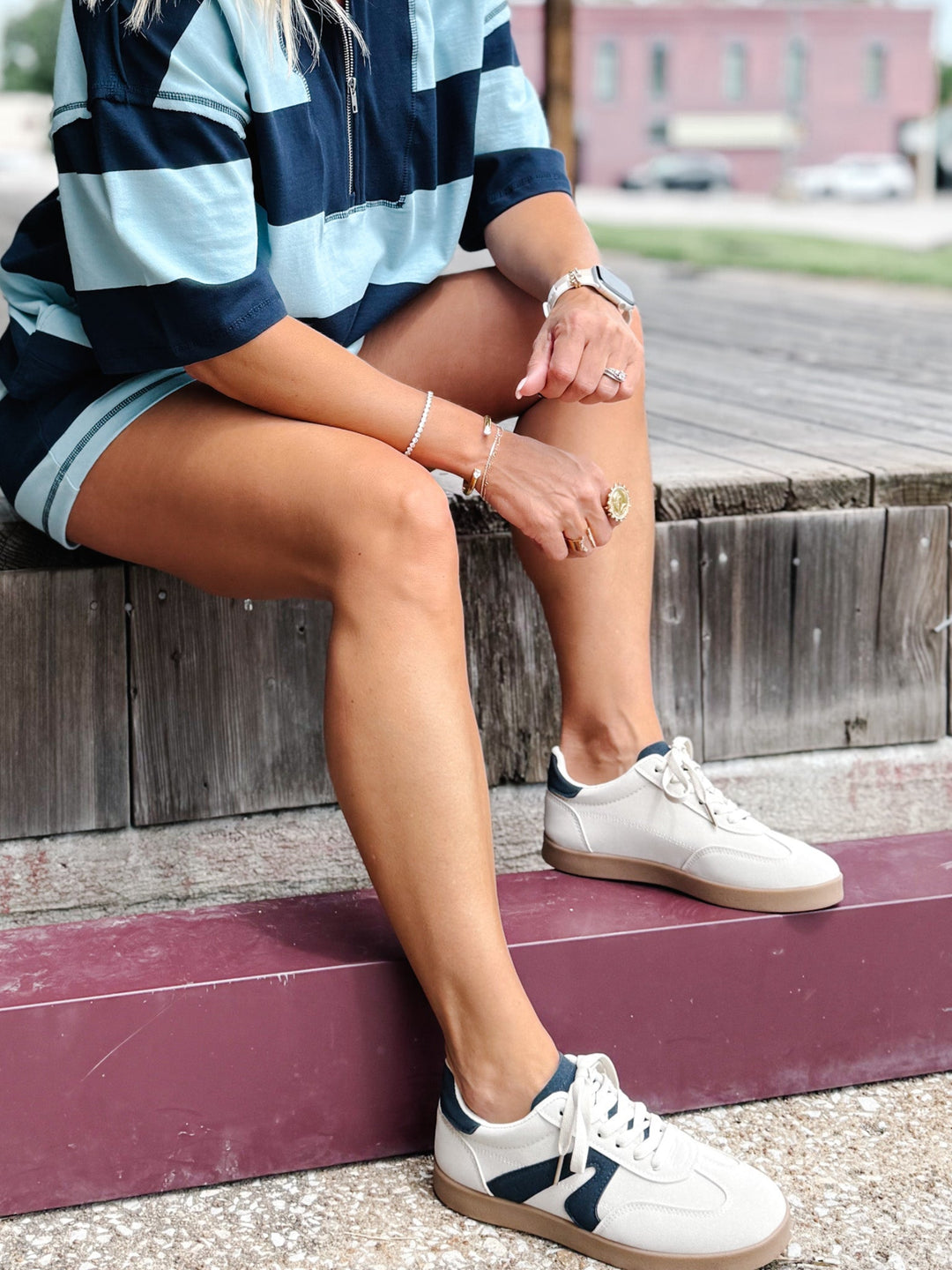 Retro sneaker in beige and navy with a lace-up closure and cushioned footbed, shown with stripe set