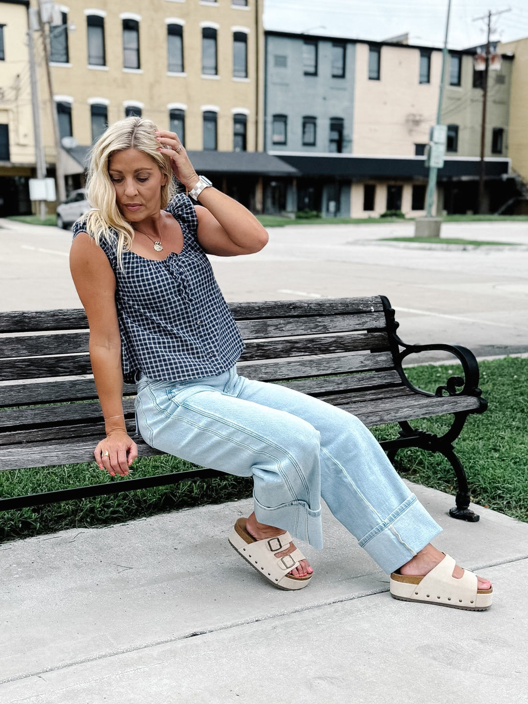 Light wash wide leg jeans with super a high-rise waist and oversized cuffed hems.