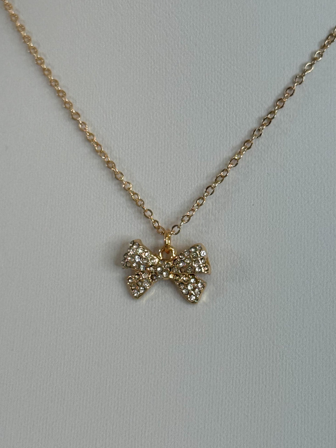 Sweet Charm Bow Necklace. Gold