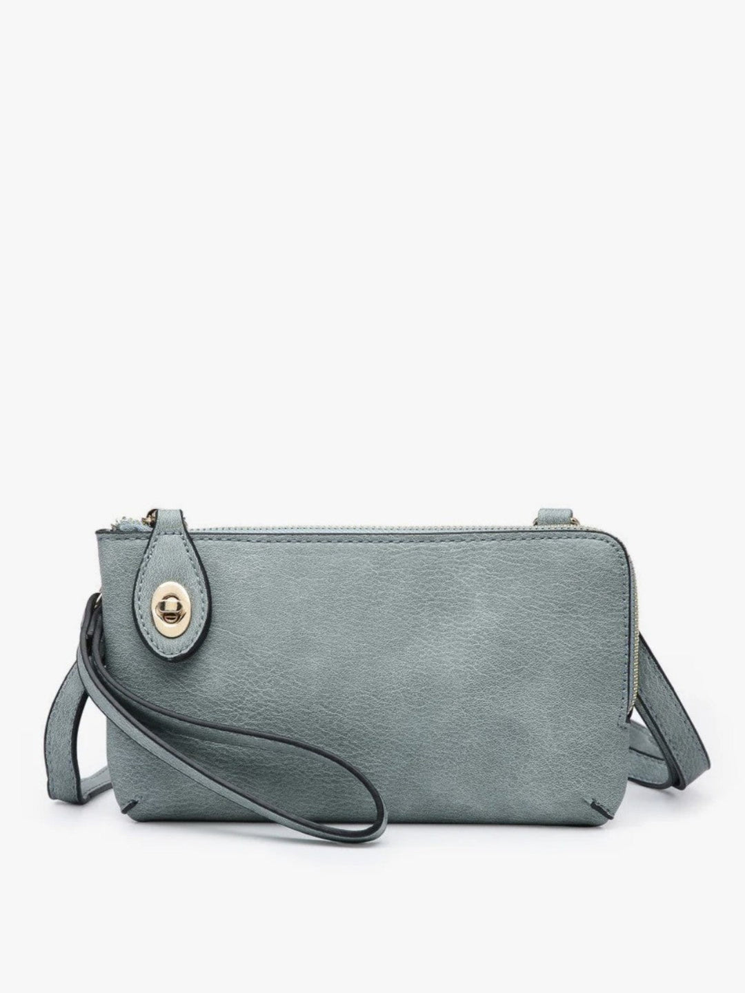 A dusty blue-gray faux leather crossbody clutch bag with a wristlet strap and a gold-tone snap button closure, shown against a plain white background.