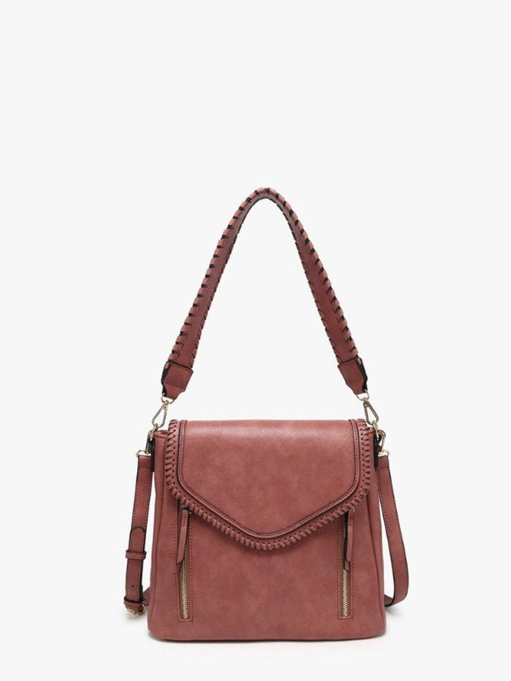A dusty rose leather shoulder bag with braided leather strap details, gold-tone hardware, and a zippered front pocket, shown against a plain white background.