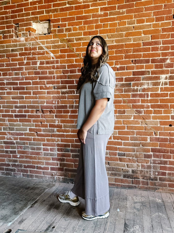 Mocha-colored mineral wash tee with a relaxed, oversized fit and raw edge details.