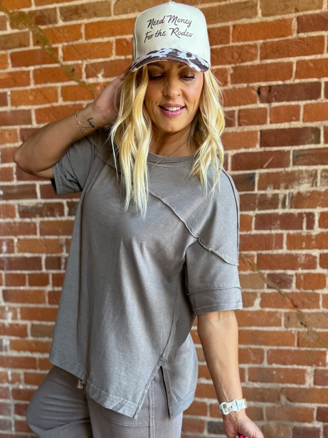 Mocha-colored mineral wash tee with a relaxed, oversized fit and raw edge details.