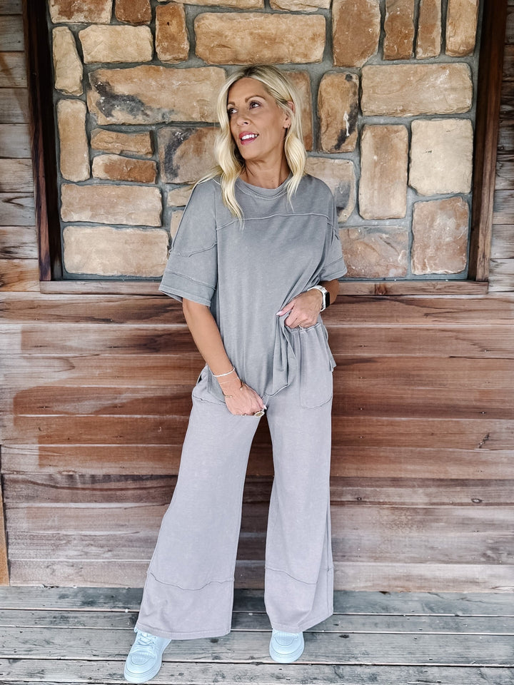 Mocha-colored mineral wash tee with a relaxed, oversized fit and raw edge details.