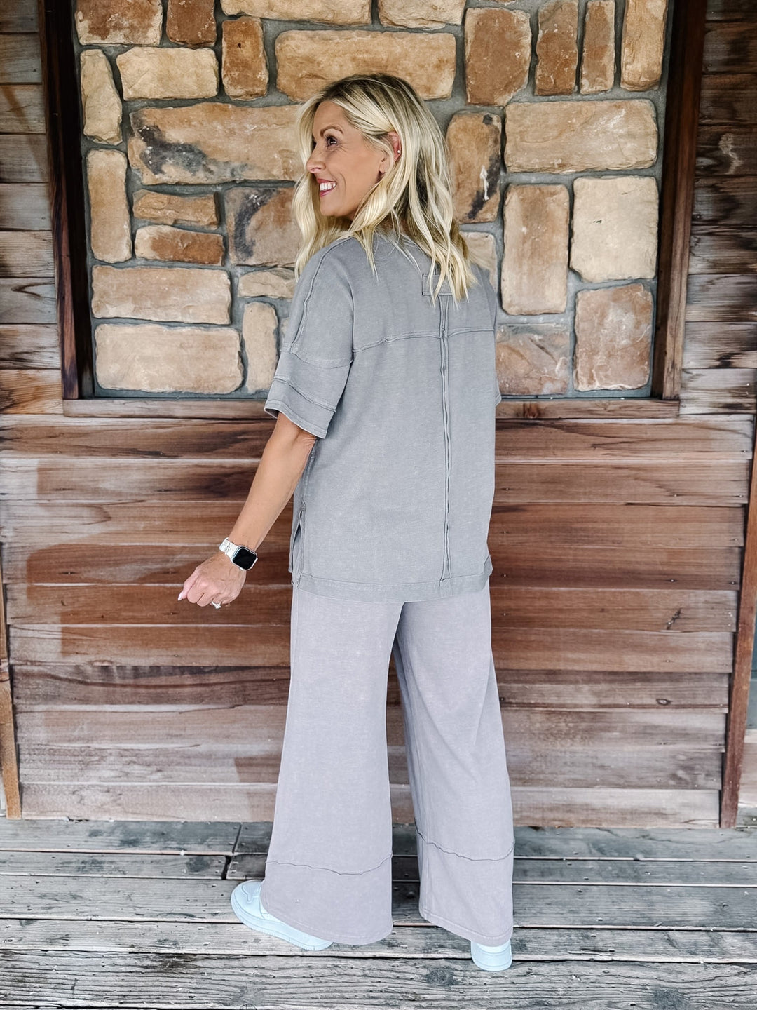 Mocha-colored mineral wash tee with a relaxed, oversized fit and raw edge details.