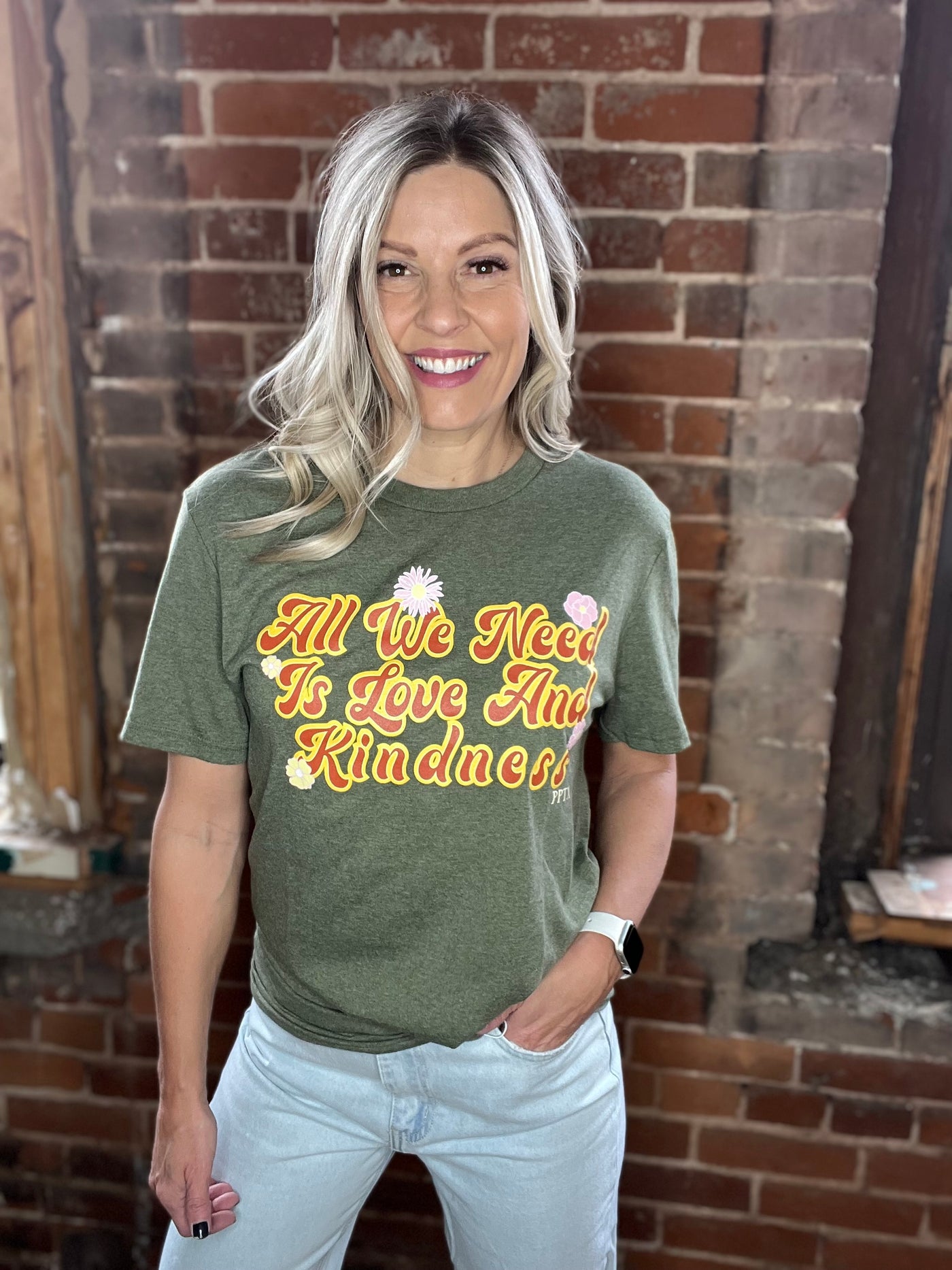 Retro All We Need Is Kindness Graphic Tee in Heather Olive